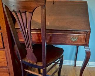 Drop front desk with antique chair