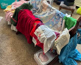 Baby clothes, cradle