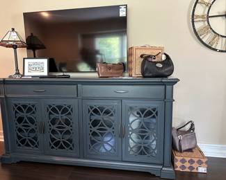 Stained Glass Table Lamp, Vintage Gucci Travel Wallet, Tresanti Luna Media Console, Lissey Artefacts Cross,  Bates Hamburgers Photograph, Samsung 55