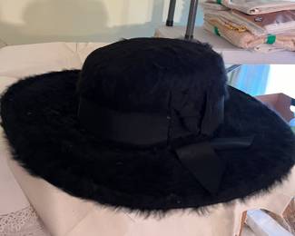 Manfred Beaver black beaverette hat, wide brim, a
wide ribbon around the crown