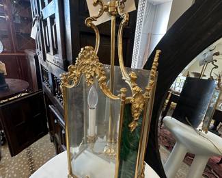 Bronzed wall bracket sconce with 2 lights. Beveled glass front with faux malachite sides.