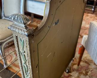 Small Daybed painted green with cane inserts in both headbboard and footboard. 