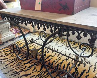 Antique iron butcher table with scrollwork. 
