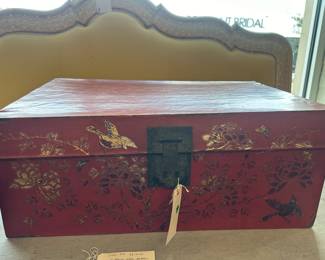 Mandarin red painted box with hinged lid. Bronze latch and handles.