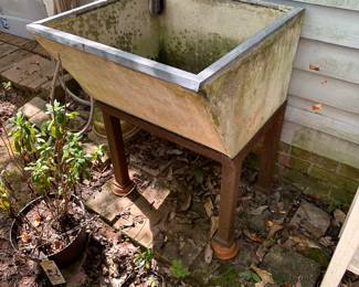 This is either a concrete or granite sink.  