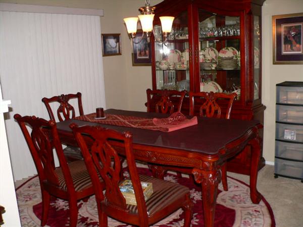 Ashley Furniture Company
Table, 1 leaf, custom table pad, 6 chairs, china hutch