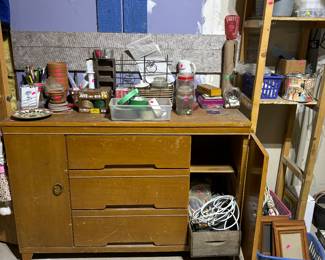 Cute mcm buffet filled with home repair