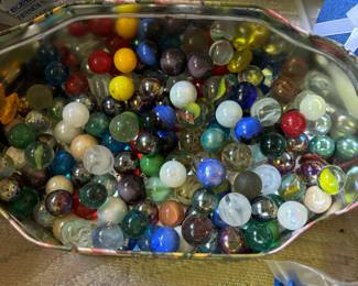 Tin of marbles $8