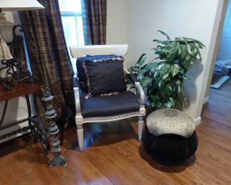 Single accent chair, ottoman pouf, plant