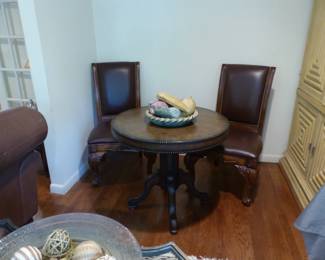 Round table with pair of chairs