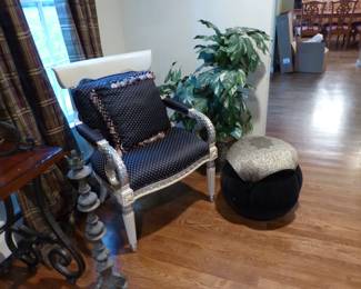 Single accent chair, ottoman pouf, plant