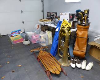 Assorted items including vintage tuba, kitchen items, golf clubs, beach towels, sled