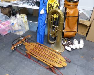 Assorted items including vintage tuba, kitchen items, golf clubs, beach towels, sled