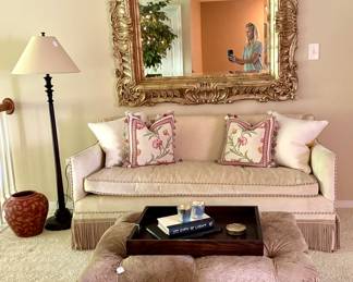 Custom sofa, gloriously large and beautiful mirror, leather ottoman on casters and designer pillows