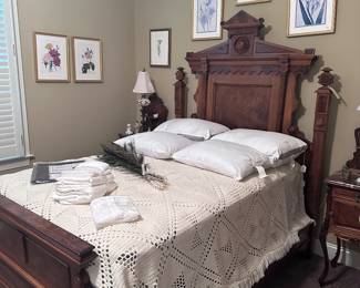 Antique bed with crochet coverlet