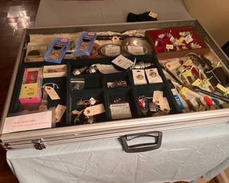 A case of small items including jewelry, sterling, pocket knives & watches.