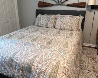 Full size bed with grey upholstered headboard and frame