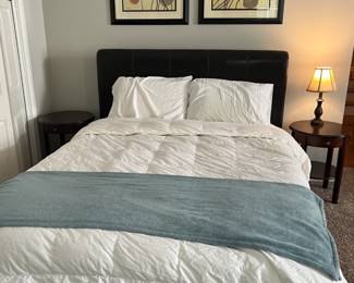 Full size bed with leather headboard and base