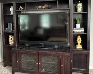 Dark brown wall unit entertainment center