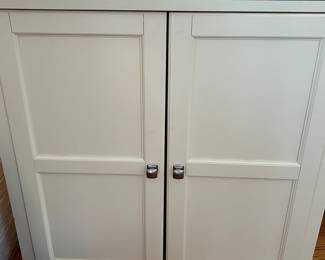 White flip-top bar cabinet