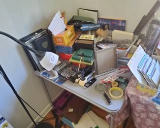 Miscellaneous office supplies. Staplers, paper, tape note pads etc