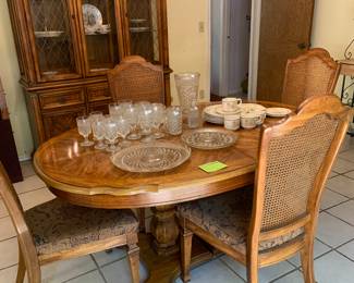 lovely formal dining room set, table with 2 leaves, table pads, and 4 chairs. (6 more chairs thrown in for free that have damage to the cane backs)
