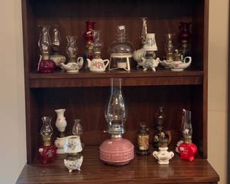 MCM bookshelf and collection of mini oil lamps