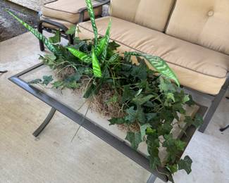 Patio sofa and glass top table