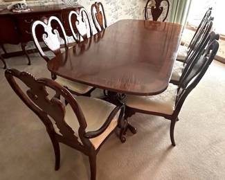Dining Table and 8 chairs; measures 44" x 68" without the two leaves. Leaves measure 15" wide each. Includes pads, made by Universal Furniture