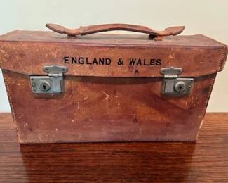Sifton Praed & Co. St. James Street, S.W.1. thirty seven folding 1930's Bartholomew maps of England & Wales in a Hide Leather Case.  The leather case is in good condition with the exception of the stout handle is not connected to the case.