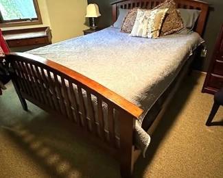 Queen-sized bed with mattresses