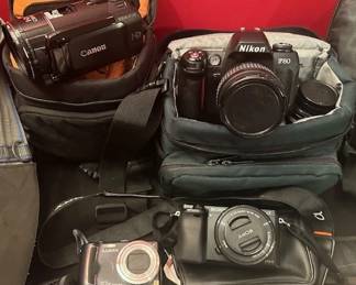 Canon Vixia HF530,  Nikon F80, Lumix 10x optical zoom,  Sony APS-C, 