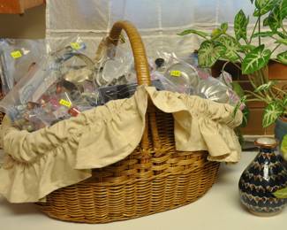 A basket full of cookie cutters and small molds