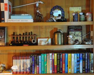 Pipes, grandfather's hummidore, a collection of Robert Parker books and Julia Child cookbooks