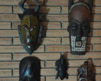 Group of 4 African masks and one unknown