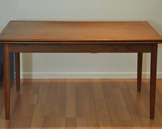 Mid Century Modern table as it sits (before being extended). 37" wide by 54" length. With 1 leaf extended it is 76" long. With both leaves extended, the table is 97" long. The piece is in very good condition with 1 chip to the table top.