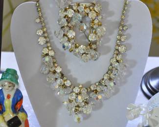 This is a 4 piece set of crystal and rhinestones by Mosell.