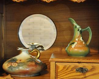 A piece of Limoges decorated by an American china painter and a piece of Roseville Snowberry green ewer