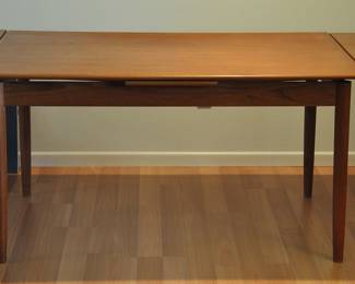 Mid Century table fully extended to 97". To extend the table you just lift up the end of the table and slide thee leaf out.