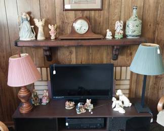Tv stand, Westinghouse TV, Yamaha AV receiver, DVD/VHS player, Monster Power conditioner, Amazon Fire TV cube, Amazon Echo dot, mantle clock, lamps