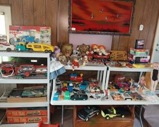 Structo and Nylint tin trucks, Trik-Trak road rally, Eldon slot car track, Playmobile Deluxe Dashboards, 1966 Hess Voyager ship, Lowe Co 1962 Bowl and Score game, Matchbox cars, Vintage Flying Tigers wall plaque