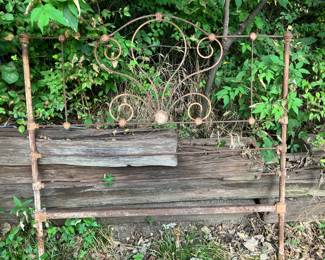 Old iron headboard used as trellis