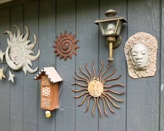 Metal suns, pottery suns, pottery face, birdhouse