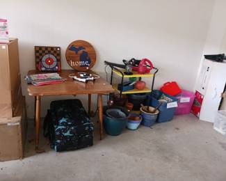 Drop leaf table and garden supplies