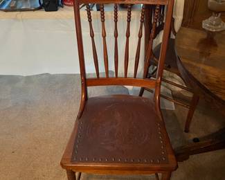 Chair that goes with table. Notice the leather seat!