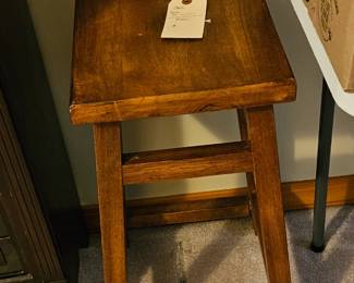 One of four wooden stools