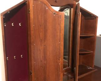 Two separate storage compartments and hidden locking drawer