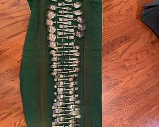 Large flatware set in a felt roll-up case