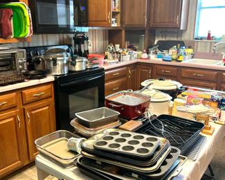 lots of kitchen items, pots and pans, electronic gadgets