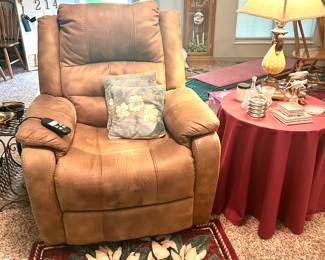 leather lift chair, floral rug side table 